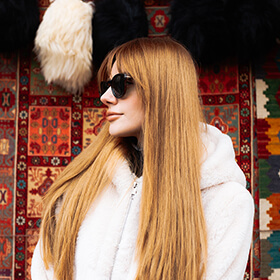 Woman portrait with traditional Azerbaijani carpets in Baku