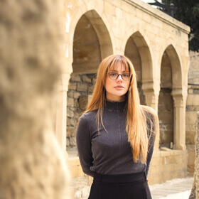 Historic stone arches and ruins of Haji Gayib Bathhouse in Baku Old City during a photo tour